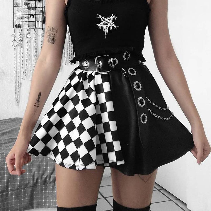 a woman wear a punk gothic black and white check patchwork dress