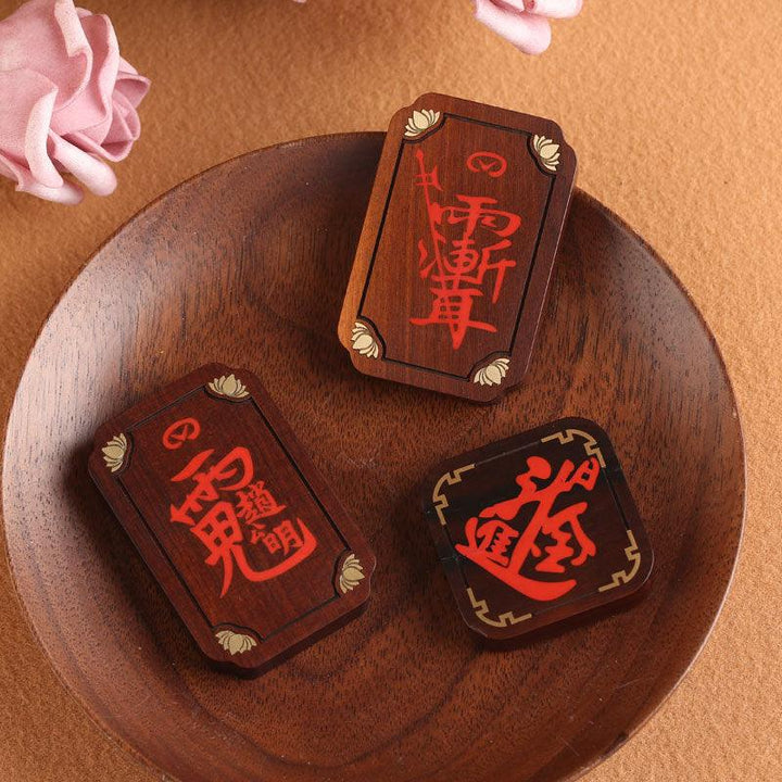 raw cinnabar taoist motifs pendant chinese feng shui necklace on the table