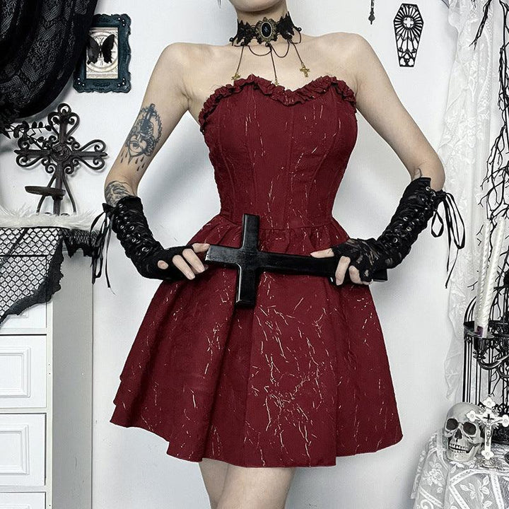 a woman wear a red and black gothic corset bustier dress