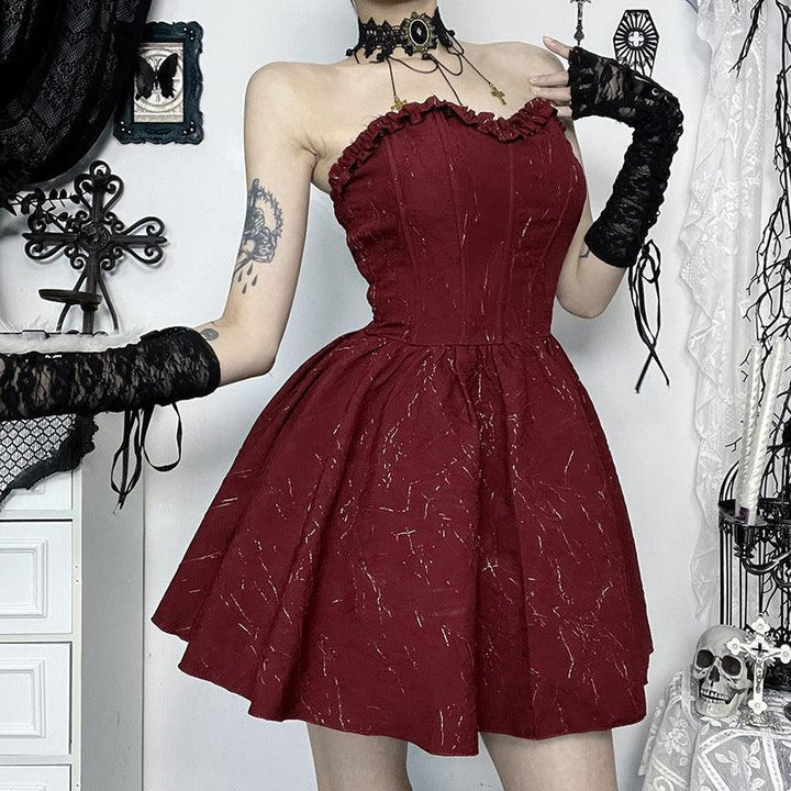 a woman wear a red and black gothic corset bustier dress