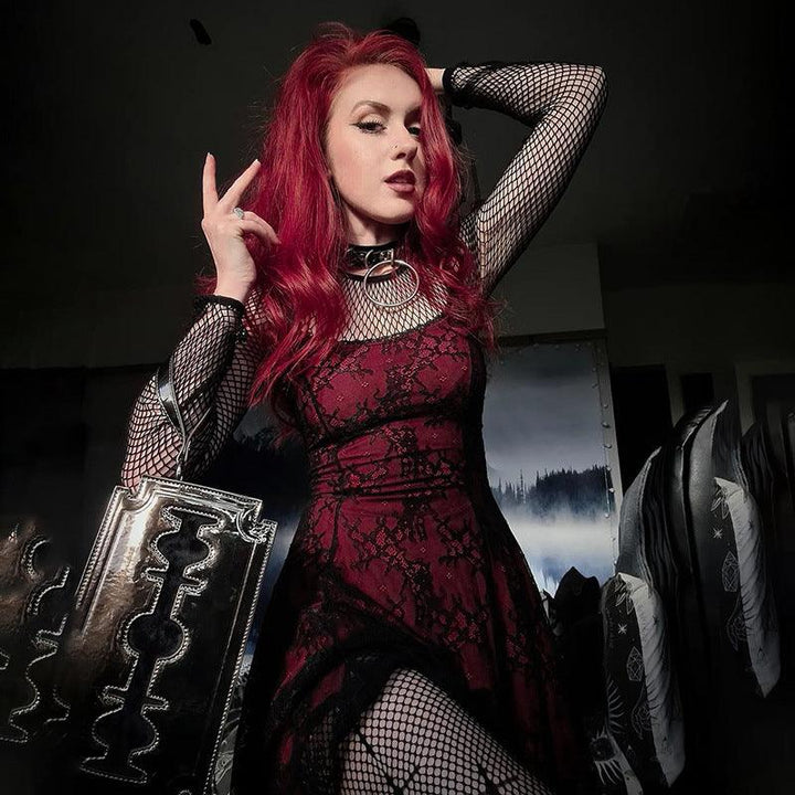 a woman wear a red and black gothic fashion corset dress