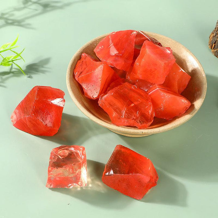 red quartz crystal raw stone aromatherapy incense stone on the table