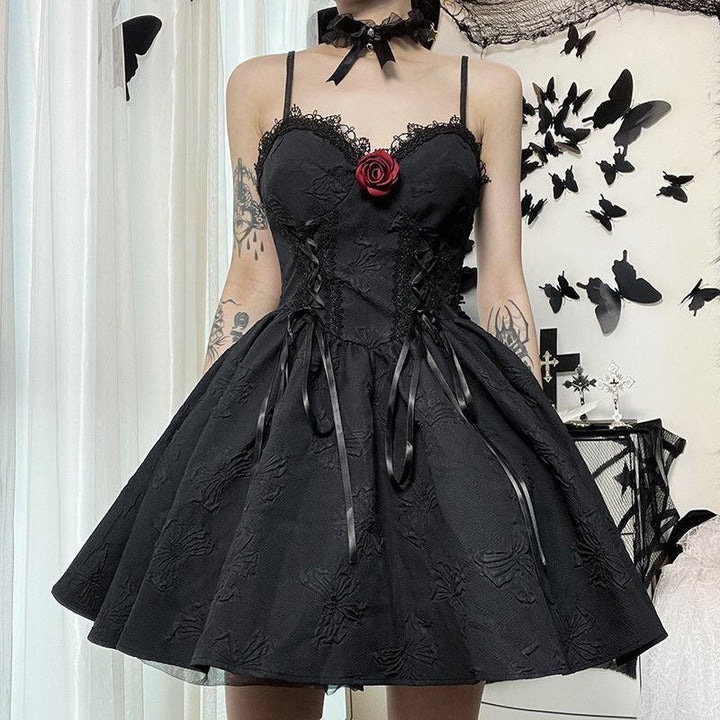 a woman wear a sleeveless short black gothic evening dress