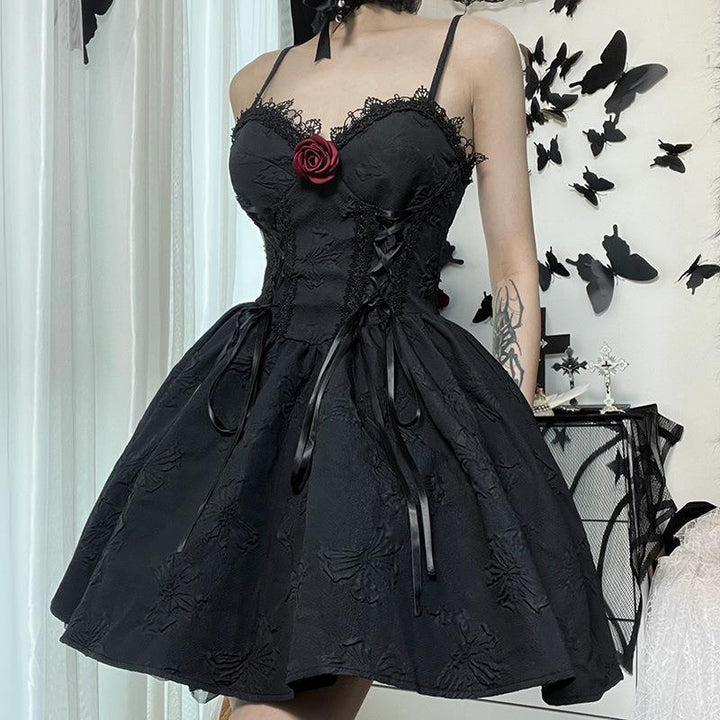 a woman wear a sleeveless short black gothic evening dress