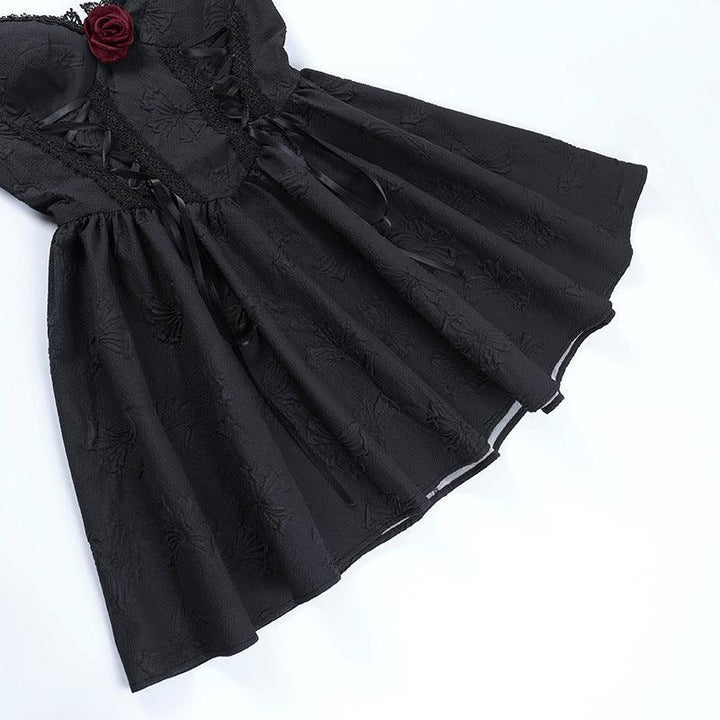 details of a sleeveless short black gothic evening dress